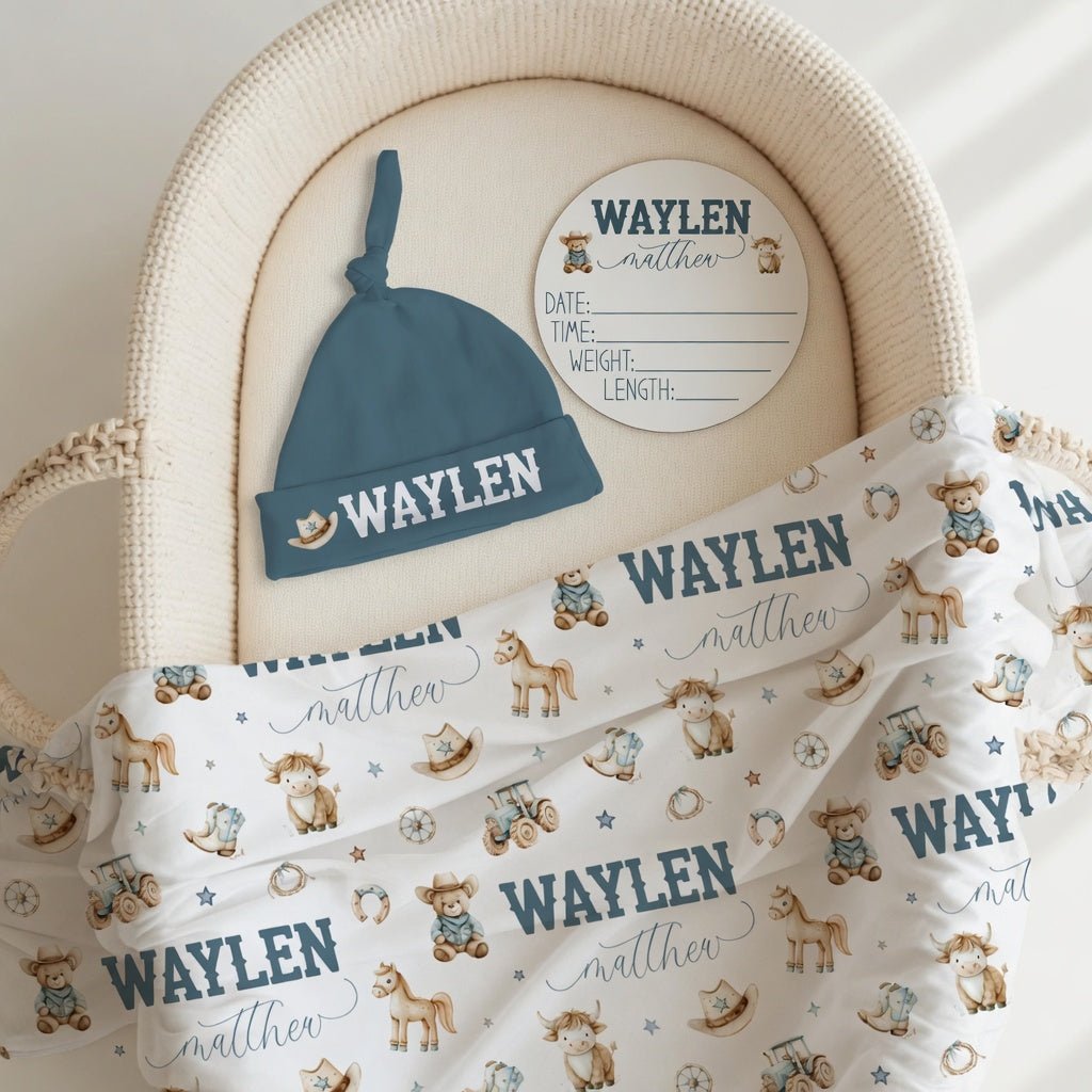 Personalized cowboy baby bundle with swaddle hat and birth stat sign in bassinet, complete western newborn gift set