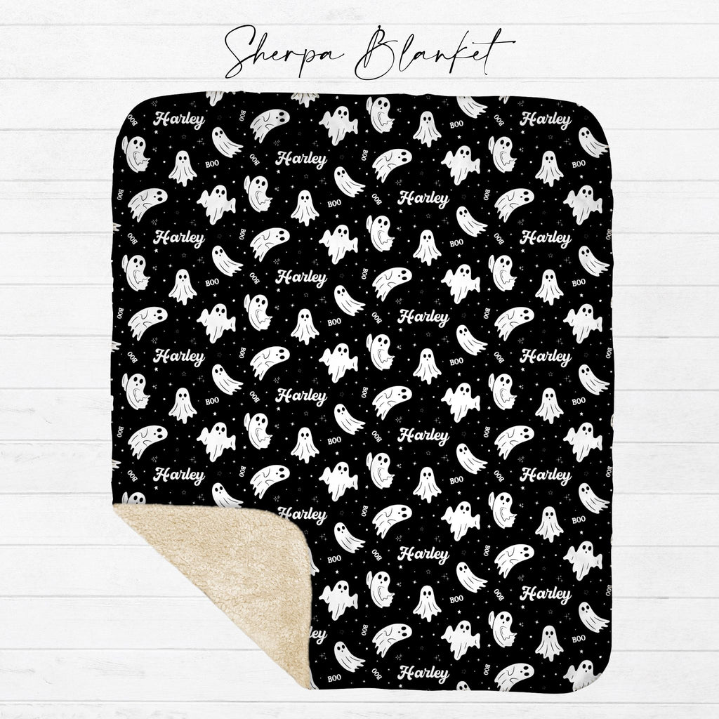 Personalized black ghost Halloween sherpa blanket with tan sherpa backing shown flat from Twinklette