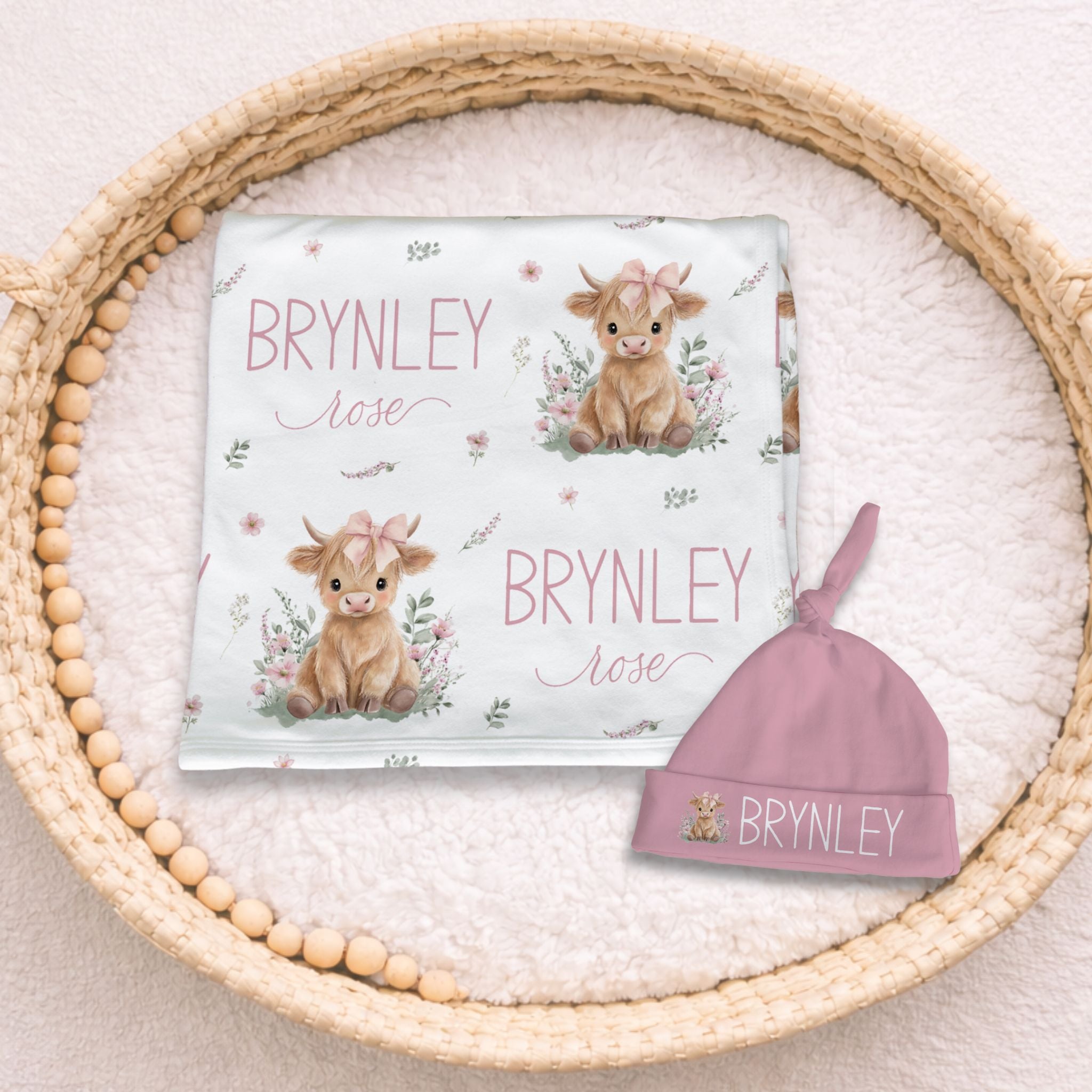 Personalized Highland Cow Pink Swaddle & Hat Set, white swaddle with pink highland cow design and custom baby name with matching pink hat