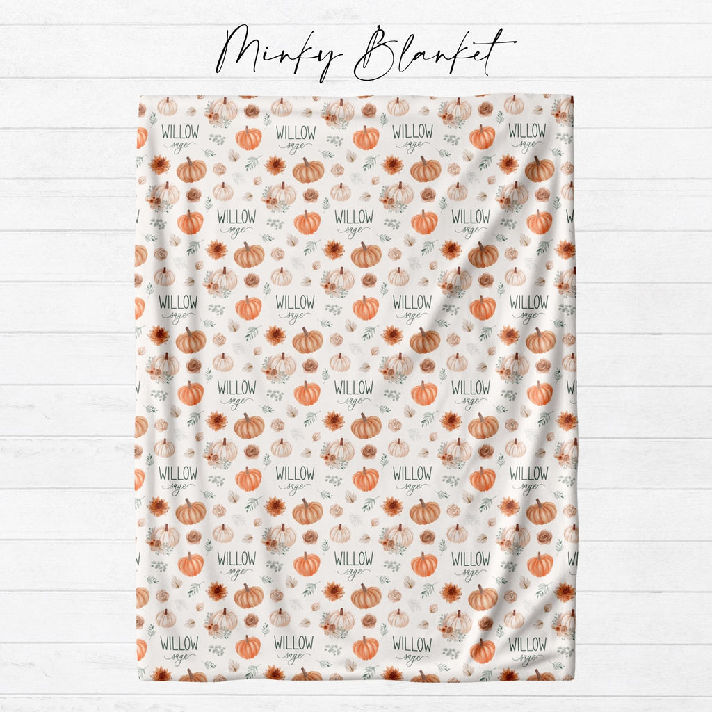 Personalized fall pumpkin minky blanket laid flat showing full watercolor pumpkin and autumn floral repeat pattern with custom name from Twinklette